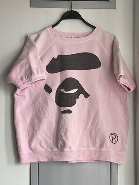 BY BATHING APE Pink Graphic Short Sleeve Sweatshirt with Bold Face Print